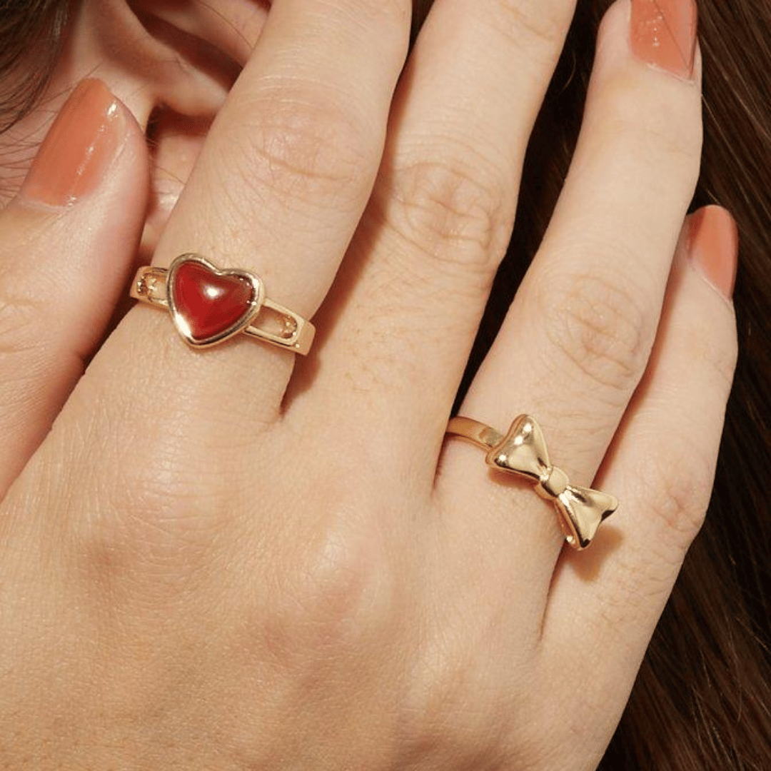 woman wearing carnelian gemstone ring – natural red stone, stacked jewelry look
